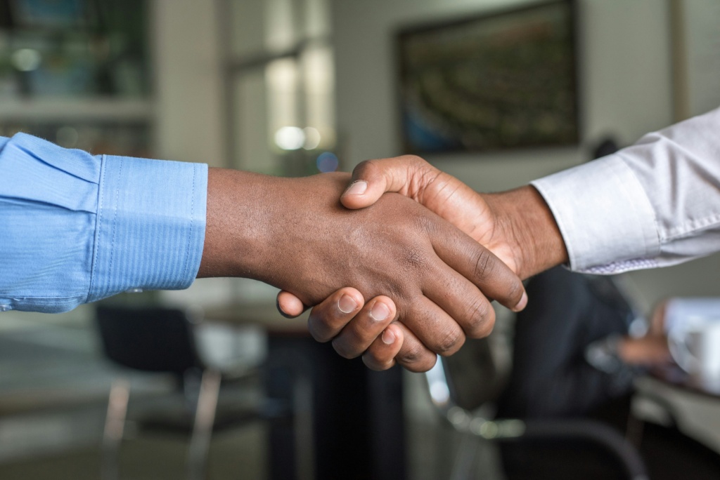 Finalised Merger And Acquisition Agreement Sealed With A Handshake