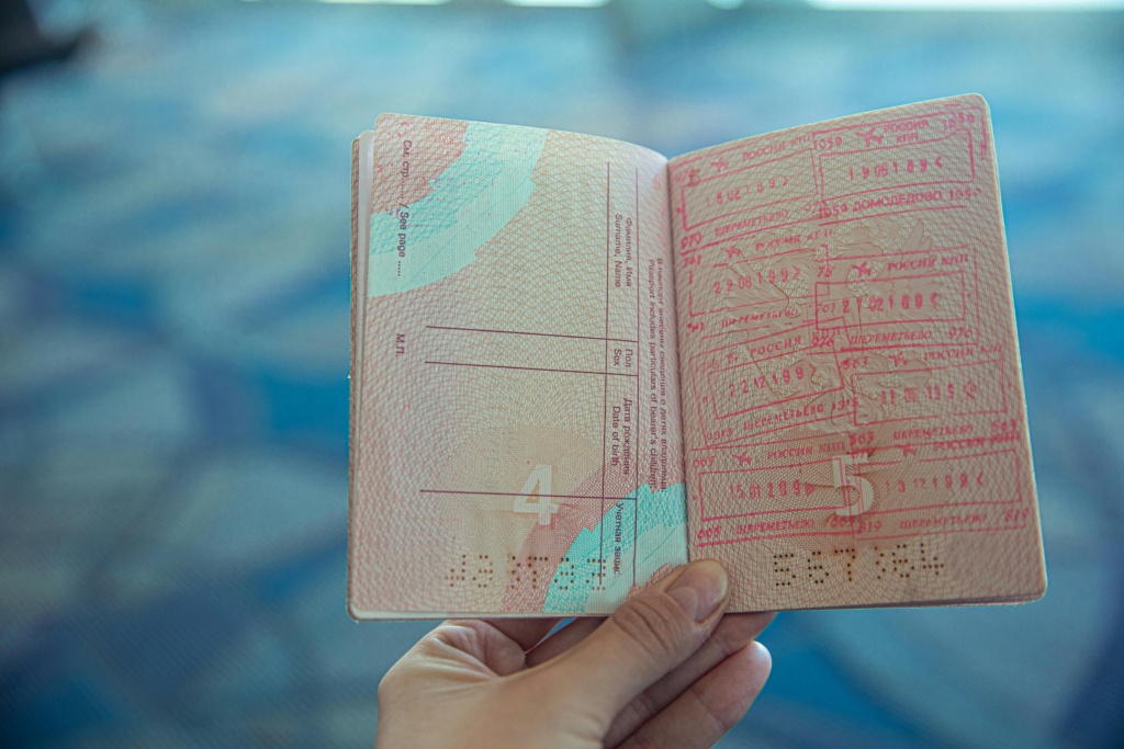 Person Holding An Open Passport