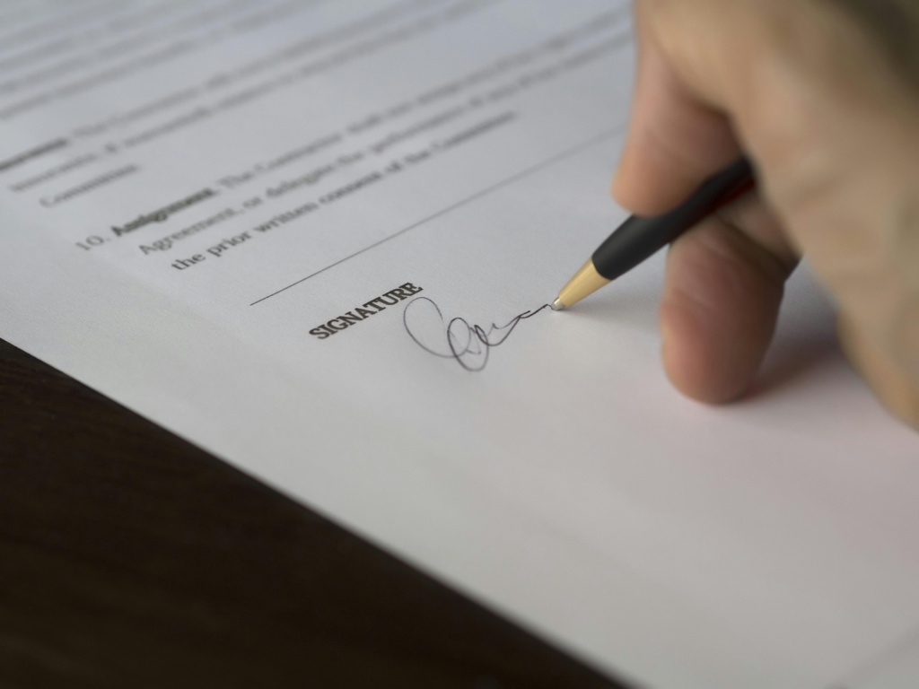 Person Signing A Business Contract