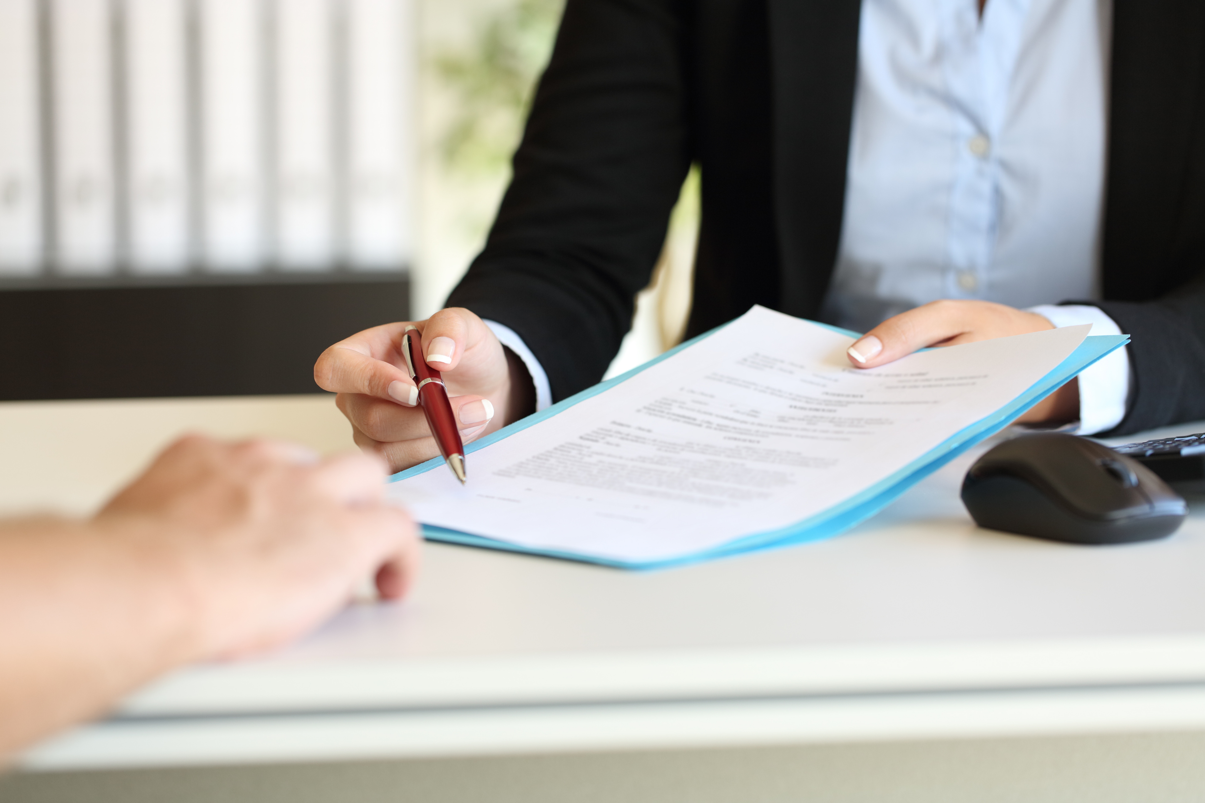 Executive Hands Indicating Where To Sign Contract
