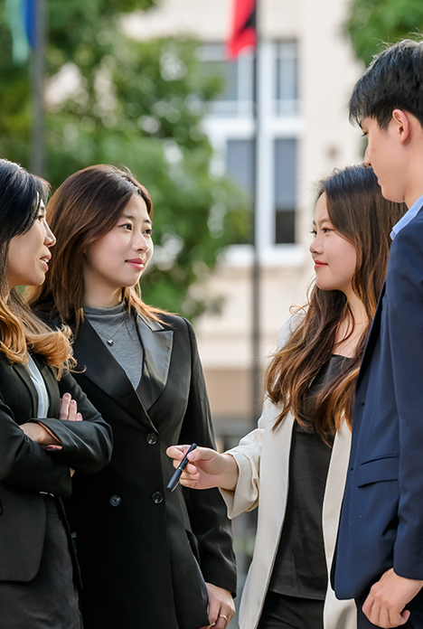 Four Businesspeople Talking Outdoors